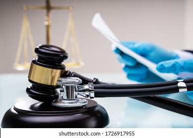 Medical Malpractice Litigation. Lawyer Or Judge In Courtroom