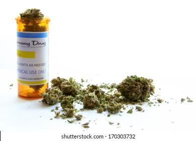 Medical Marijuana B. Medical marijuana with of a prescription bottle against white. (The label on the bottle is original, so no trademark or copyright issues)