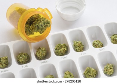 Medical Marijuana Buds Arranged In A Prescription Pill Bottle And A Weekly Pill Box