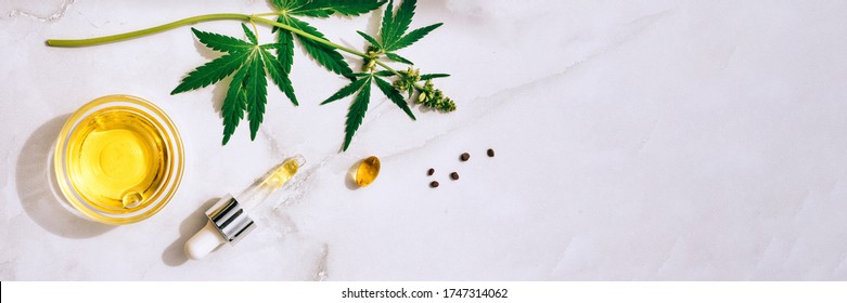 Medical Marijuana Cannabis Cbd Oil. CBD Oil Hemp Products. Macro Detail Of Dropper With CBD Oil, Cannabis Live Resin Extraction On White Background. Medical Marijuana Concept