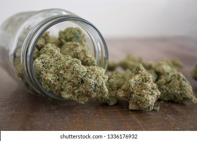 Medical marijuana flower buds. Recreational marijuana strain. Cannabis strain. Weed bud in the glass jar. Dispensary menu. Hemp buds.