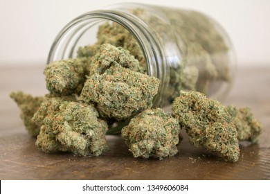 Medical marijuana flower buds. Recreational marijuana strain. Cannabis strain. Weed bud in the glass jar. Dispensary menu. Hemp buds.