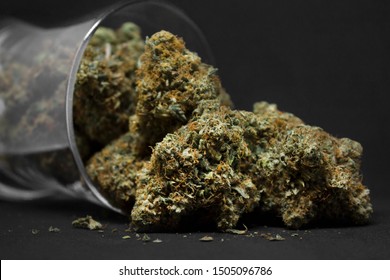 Medical Marijuana Flower Buds. Recreational Marijuana Strain. Cannabis Strain. Weed Bud In The Glass Jar. Dispensary Menu. Hemp Buds.