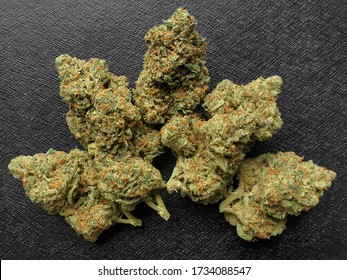 Medical Marijuana Flower Buds. Recreational Marijuana Strain. Cannabis Strain. Weed Bud In The Glass Jar. Dispensary Menu. Hemp Buds.