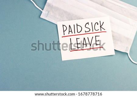 medical mask with the inscription paid sick leave