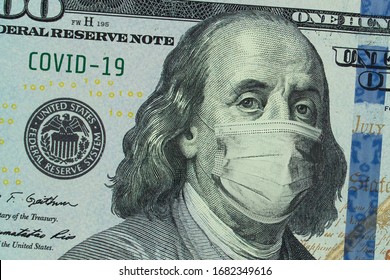 Medical mask on a banknote of 100 dollars, concept of the global financial crisis. Medical mask or surgical mask on american money. COVID-19 coronavirus in USA. Doctor mask protects against COVID-19. - Shutterstock ID 1682349616