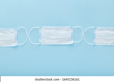 Medical mask, Medical protective masks on blue background. Disposable surgical face mask cover the mouth and nose. Healthcare and medical concept.