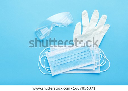 Medical mask, Medical protective masks and white rubber gloves, glasses. Coronavirus, Covid-19 protection by respirator, surgical face mask. Concept medicine health care.Medical sterile equipment