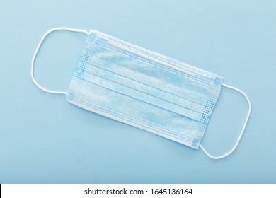 Medical mask, Medical protective mask on blue background. Disposable surgical face mask cover the mouth and nose. Healthcare and medical concept. - Shutterstock ID 1645136164
