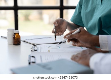 Medical Meetings for teams in the office to discuss brainstorm and plan, research, diagnosis, experiments, medicine, doctors, nurses and laptops recording data teamwork or a workshop for data analysis - Powered by Shutterstock