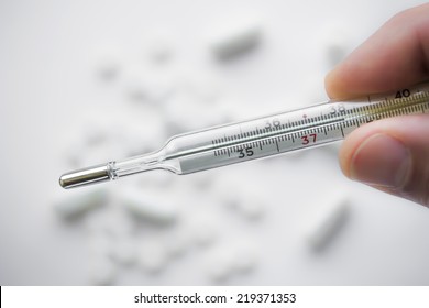 Medical mercury thermometer. Medical mercury thermometer showing elevated body temperature.