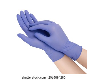 Medical nitrile gloves. Blue surgical gloves isolated on white background with hands. Rubber glove manufacturing, human hand is wearing a latex glove. Doctor or nurse putting on protective gloves