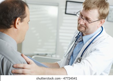 Medical Office - Male Doctor  Telling Bad News To Patient .