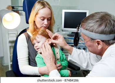 Medical Otitus Examination Of A Little Child At A Ear Nose Throat Doctor