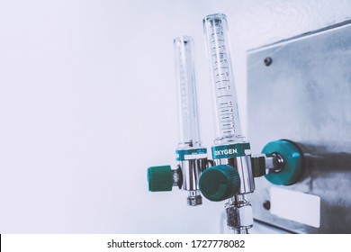 Medical Oxygen Flowmeter Tube In The Hospital Ward To Help Patients Breathing Therapy From Acute Respiratory Disease. Healthcare And Medical Background With Copyspace.