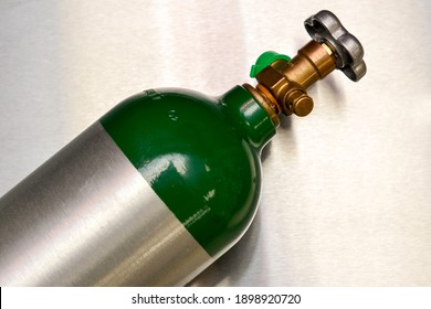 Medical Oxygen Tank On Stainless Steel Background