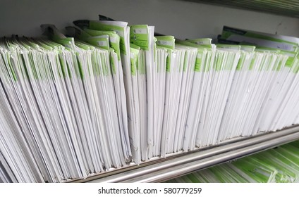 Medical Patient Files Paper On Shelf In Clinic And Hospital For Reccord Health Care Book