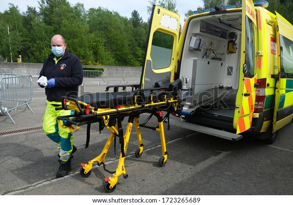 Μembers of the medical personnel check people in\
the testing site for COVID-19  in University Hospital of Liege in\
Belgium on May 5th,\
2020.
