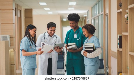 Medical personnel stand at a doctor's meeting, give advice, nurses and assistants, hospital personnel, professionalism - Powered by Shutterstock