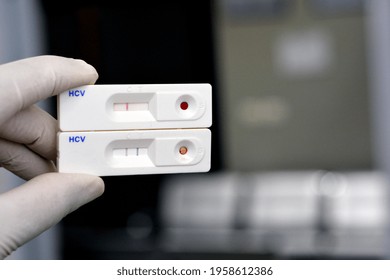 A Medical Personnel That Holds 2 Rapid Test Results For Hepatitis C Virus, A Negative And A Positive Results For Hepatitis C Virus Antibodies That Was Found In A Screening For The Virus