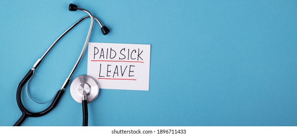 Medical Phonendoscope With The Inscription Paid Sick Leave On A Blue Background. FMLA Family Medical Leave Act