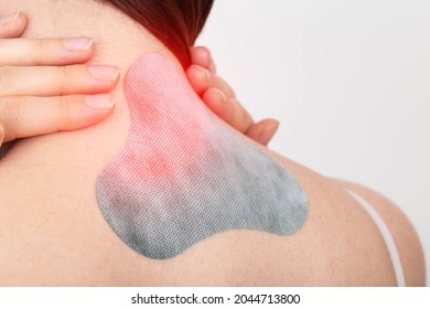Medical plaster for relieving pain in the neck and spine. Anti-inflammatory with analgesic effect, elimination of muscle spasm in the girl's neck, intervertebral hernia