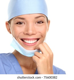 Medical Professional: Young Doctor Or Woman Nurse Smiling Taking Her Surgeon Mask Off. Closeup Portrait Isolated On White Background.