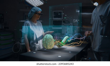 Medical professionals in AR headsets work in operating room using holographic display. 3D graphics of virtual human skeleton and organs. Technology of AI-assisted surgery. Healthcare innovation. - Powered by Shutterstock