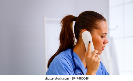 Medical Receptionist Answering Phone Calls From Patient In Hospital Checking Appointment. Healthcare Physician In Medicine Uniform, Doctor Nurse Assistant Helping With Telehealth Communication