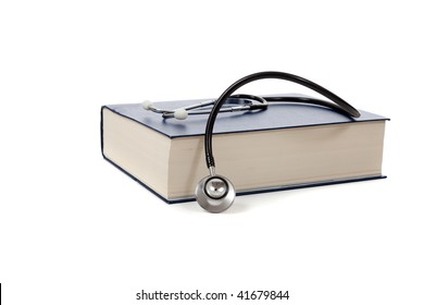 A Medical Reference Book With A Stethoscope On A White Background