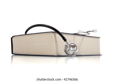 A Medical Reference Book With A Stethoscope On A White Background