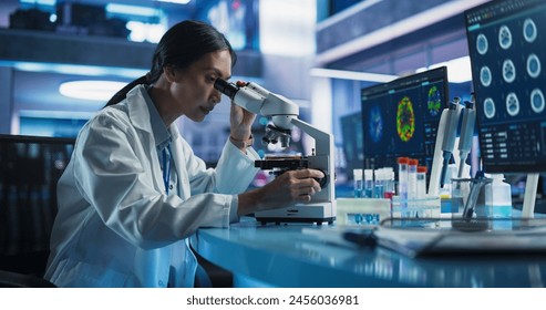Medical Research And Development Center: Female Asian Scientist Using Microscope To Analyze Petri Dish Sample. Specialist Developing Innovative Medicine For Treating Mental Disorders Or Pain Relief.