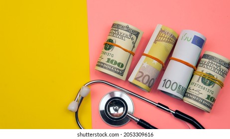 Medical Research  Health Concept. Breakthrough On Medical Field. Selective Focus On A Statestoscope, Magnifying Glass, Fake Money.