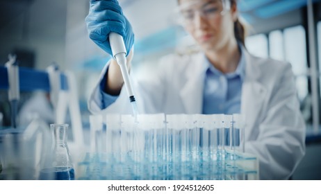 Medical Research Laboratory: Portrait of a Beautiful Female Scientist in Goggles Using Micro Pipette for Test Analysis. Advanced Scientific Lab for Medicine, Biotechnology, Microbiology Development - Shutterstock ID 1924512605