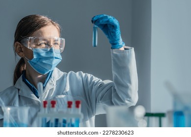 Medical research laboratory. A scientist works with a pipette and a test tube. Scientific laboratory of biotechnology, development of medicine and research in chemistry, biochemistry and experiments. - Shutterstock ID 2278230623