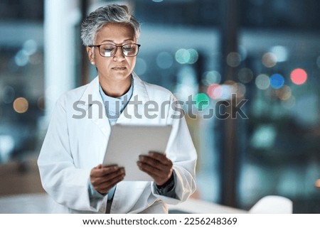 Medical, research and night with doctor and tablet for planning, medicine and schedule. Technology, review and digital with senior woman reading report for healthcare, science and life insurance news