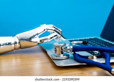 Medical robot hand using laptop. - Powered by Shutterstock