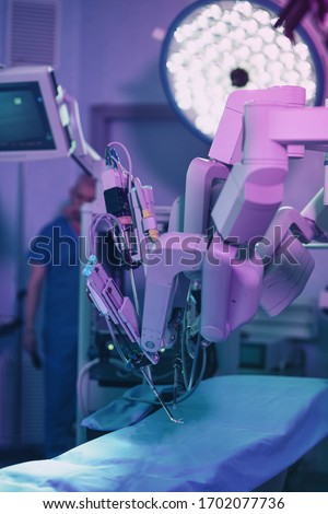 Medical robotic surgical arm, surgeon medical robot davinci surgery technology machine.Robotic surgery for neurosurgery medical robotic futuristic health care medicine. Minimally invasive microsurgery