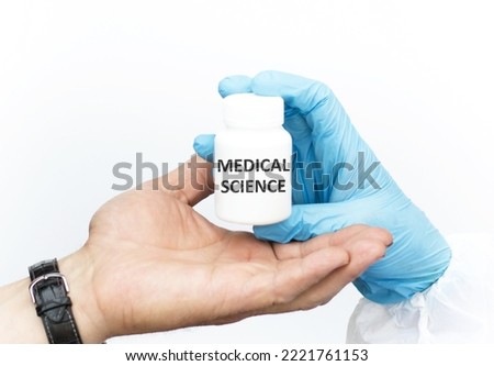 Medical Science inscription on a white jar, close-up of the hands of the doctor and the patient. Medical concept