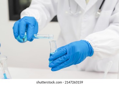 Medical Science Laboratory: Portrait Of Beautiful Black Scientist Looking Under Microscope Does Analysis Of Test Sample. Ambitious Young Biotechnology Specialist, Working With Advanced Equipment