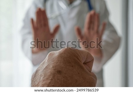 Medical staff abuse. Stop threatening behaviour towards a doctor, Physician. Angry and violent patient. Zero tolerance.  