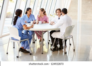 Medical Staff Chatting In Modern Hospital Canteen