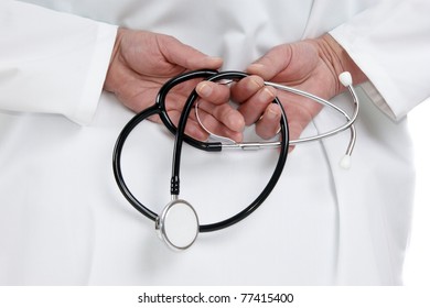 medical staff member holding a stethoscope with both hands