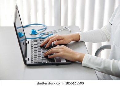 Medical staff operating a personal computer