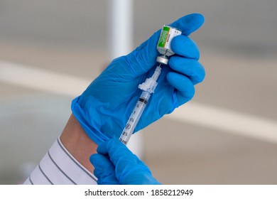 A Medical Staff Prepares An Influenza Vaccine During A Drive-thru Free Flu Shots To Members Of The Los Angeles Community At Cal State LA Parking Lot In Los Angeles, Friday, Nov. 20, 2020.