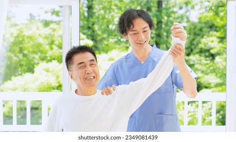 Medical staff treating shoulder pain. - Powered by Shutterstock