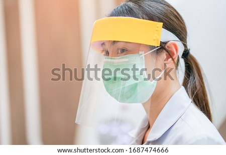 Medical staff wearing face shield and medical mask for protect coronavirus covid-19 virus in CT scan room, protective Epidemic virus outbreak concept