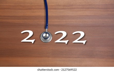 Medical Stethoscope With 2022 Number On Background. Happy New Year For Healthcare,