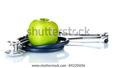 Medical stethoscope and apple isolated on white