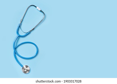Medical stethoscope isolated on blue background. stethoscope is an important diagnostic tool for doctor. listening to the lungs for inflammation. copy space, blue medical Flat lay, top view.